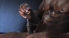 Black stud sticks a rod in his dick and plays with his balls