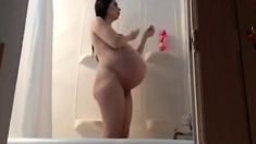 Pregnant woman taking a shower